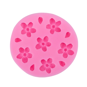 Pink silicone mold featuring six flowers and four petals shapes for baking decoration