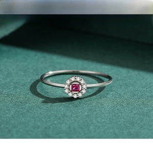 Detailed view of s925 silver ring featuring a square red zircon and diamond halo