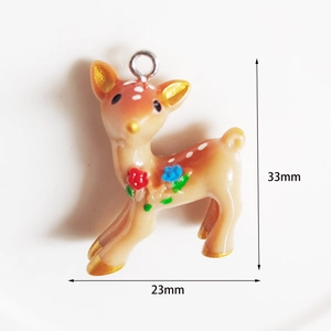 Detail view of a 33x23mm brown resin deer pendant with floral patterns and gold accents