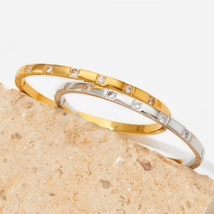 Minimalist stainless steel bracelets with white zircon stones on natural stone base