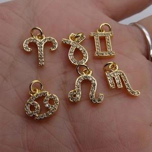 Golden zodiac sign charms set with sparkling zircon inlays for DIY jewelry making