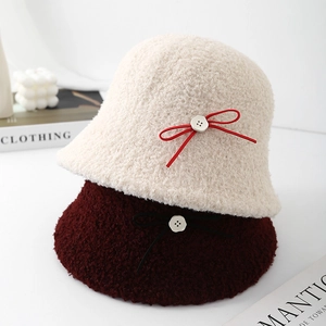 Winter faux fur bucket hats with cute bows in beige and burgundy colors