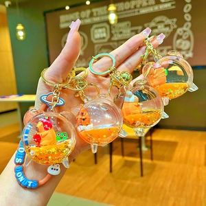 Set of cute capybara liquid sand keychains with strawberry charms and golden rings