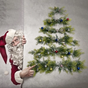 DIY wall-mounted Christmas tree with colorful pine needles and festive baubles decoration