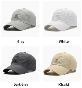 Detail of four breathable mesh baseball caps in gray, white, dark gray and khaki colors
