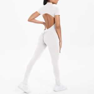 Detail of white cutout back and scrunch butt design on athletic short sleeve jumpsuit