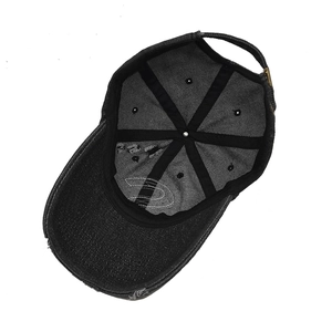 Detail view of the black denim baseball cap interior with reinforced seams and embroidery