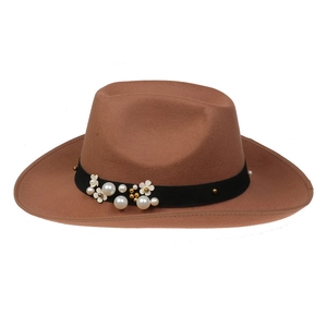 Close-up of brown wool felt cowboy hat featuring faux pearls and gold flower accents