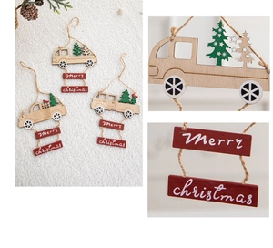Detail of wooden Christmas truck ornaments with Merry Christmas signs and hanging ropes