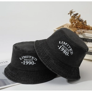 Detail showing vintage washed cotton bucket hats with Limited Edition 1990 embroidery