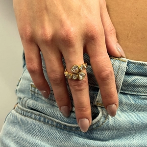 Fashionable hollow geometric gold heart ring with cubic zirconia worn on hand
