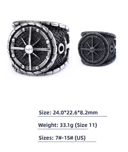 Detail view of retro navy anchor compass rings in silver and matte black finishes