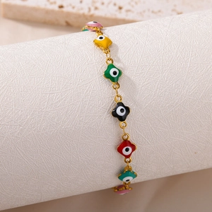 Detailed view of colorful evil eye clover bracelet with gold plating and enamel charms