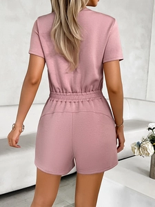 Rear view of pink casual romper showing elastic waist design and zipper detail on back