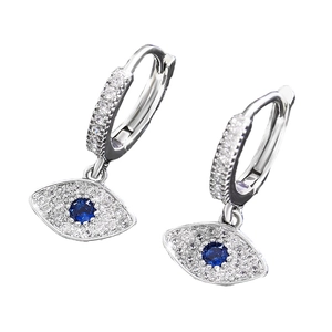 Silver Evil Eye drop earrings with blue crystal and white stones on white background