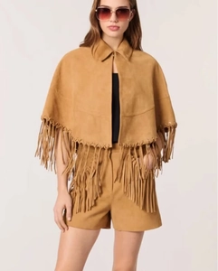 Detail of a brown suede shawl jacket with fringe trim and matching shorts set