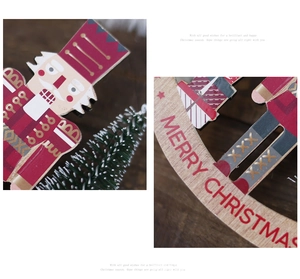 Detail of wooden Nutcracker ornament with red Merry Christmas text and festive design