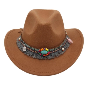 Close-up of brown wool fedora with bohemian beadwork and turquoise stone detail