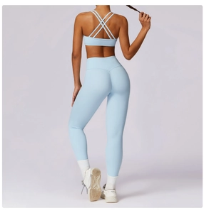 Rear view of light blue high-waist yoga set showing seamless fit and cross back design