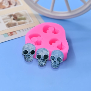 Pink silicone skull mold for DIY cake baking and resin crafting with three skull cavities