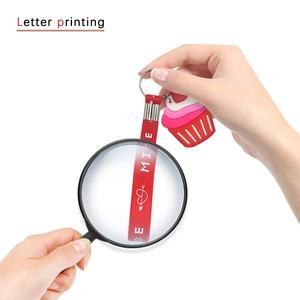 Silicone cupcake keychain with red printed hand strap and heart pendant accessory