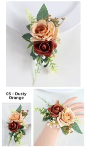 Detailed view of rusty orange and champagne silk rose wrist corsage for wedding events
