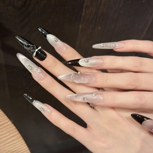 Handmade pink purple cat-eye press-on nails with 3D black bows and rhinestone accents