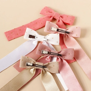 Corduroy bow hair clips for girls with gold polka dots in pink and beige tones