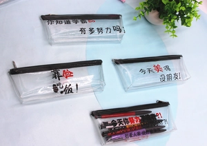 Detail of transparent PVC pencil bags with black zippers and Chinese graphic slogans