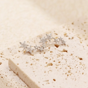 Macro shot of S925 sterling silver star stud earrings with sparkly cubic zirconia