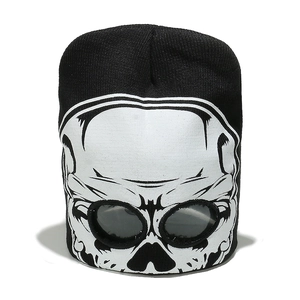 Detail of black knit beanie with skull print and integrated goggles for biker style