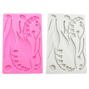 Detail of pink and white lily of the valley silicone molds for fondant cake decoration