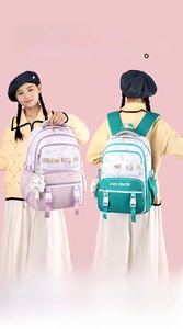 Detail showing high-density water-resistant fabric and padded straps on student backpack