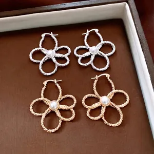 Elegant hollow flower earrings with pearls in gold and silver finish for women