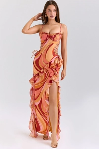 Detailed view of the hollow-out side lace-up and colorful swirl print of the dress