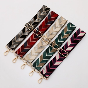 Adjustable woven shoulder straps with geometric V-patterns and gold metal hardware