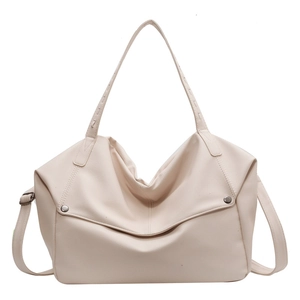 Large cream PU leather tote bag with metal rivets and adjustable crossbody strap