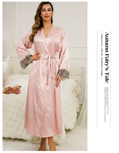 Close-up of pink silk satin robe featuring elegant grey lace embroidery on sleeves