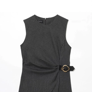 Dark grey striped sleeveless midi dress with gold buckle belt flat lay on white background