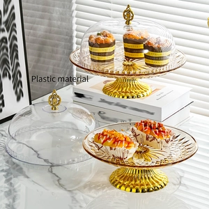 European style amber plastic fruit bowl with lid and golden base for cakes and desserts