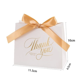 Mini white paper wedding gift bag with gold ribbon and 11.5x10x4.5cm size details