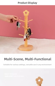 Detail of wooden branch rack for keys and jewelry with floral top decoration