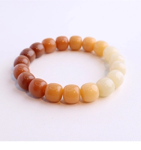 Macro detail of natural weathered bodhi seed beads with smooth gradient colors