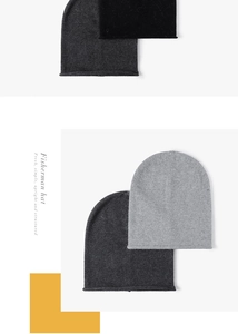 Detailed knit texture of rabbit fur hats in black, dark gray and light gray colors