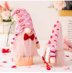 Close-up of pink Valentine gnomes with heart hats and soft plush texture details
