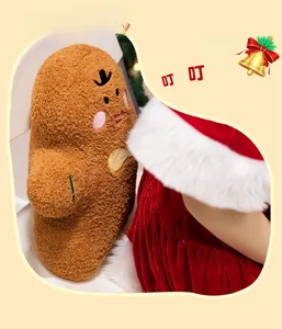 Close-up of brown plush gingerbread man cushion with crown detail and soft texture