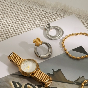 Elegant set with gold silver mixed earrings, gold watch and beaded bracelet