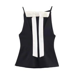 Women's black camisole top featuring a large white satin bow on the neckline