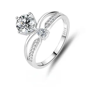 Detailed view of S925 silver engagement ring with crown design and large round moissanite