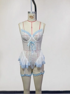 Detail of white lace bodysuit with blue ribbon lacing and matching leg garter accessories